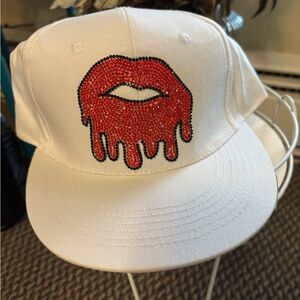 Chic White Hat with Dripping Red Lip Design